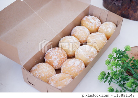 delicious snowball donuts as a background delicious snowball donuts as a background 115981142
