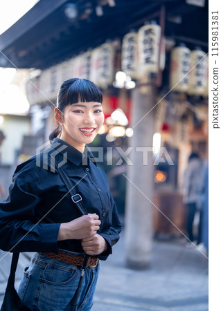 Young woman sightseeing in Osaka Young woman sightseeing in Osaka 115981381