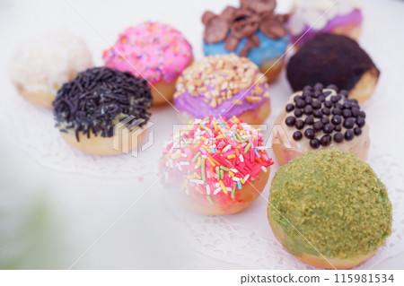 ball donuts with various flavors as a background ball donuts with various flavors as a background 115981534