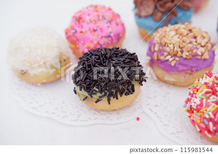 ball donuts with various flavors as a background 115981544
