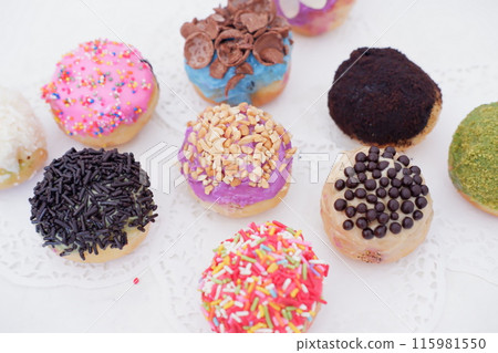 ball donuts with various flavors as a background 115981550