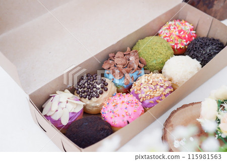 ball donuts with various flavors as a background ball donuts with various flavors as a background 115981563