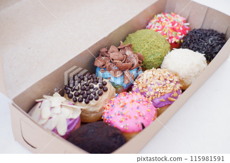 ball donuts with various flavors as a background ball donuts with various flavors as a background 115981591