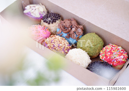 ball donuts with various flavors as a background 115981600