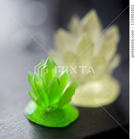 Detailed models in the form of crystals printed on 3D printer from polymer close-up. Detailed object created by 3D printer using the 3D printing method. Concept 3D Printing. SLA printing technology 115981602