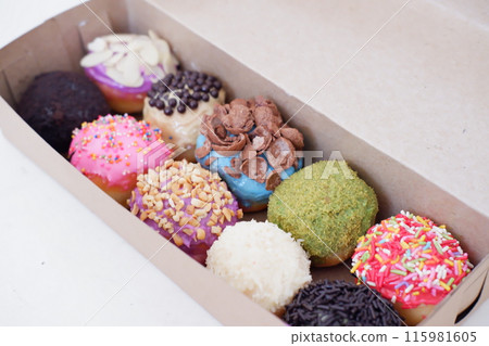 ball donuts with various flavors as a background ball donuts with various flavors as a background 115981605