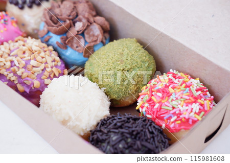 ball donuts with various flavors as a background ball donuts with various flavors as a background 115981608