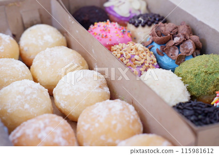 ball donuts with various flavors as a background 115981612