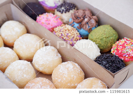 ball donuts with various flavors as a background ball donuts with various flavors as a background 115981615
