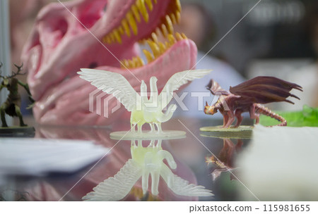 Detailed models in the form of birds printed on 3D printer from polymer close-up. Detailed object created by 3D printer using the 3D printing method. Concept 3D Printing. SLA printing technology 115981655