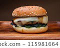 Cheese hamburger with buttered spinach 115981664