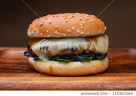 Cheese hamburger with buttered spinach Cheese hamburger with buttered spinach 115981664