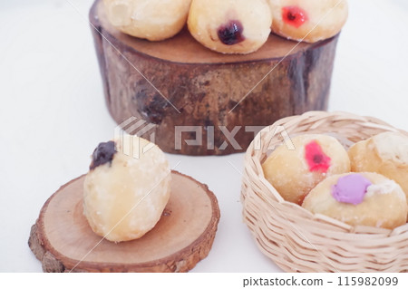 flavored ball donuts as a background flavored ball donuts as a background 115982099