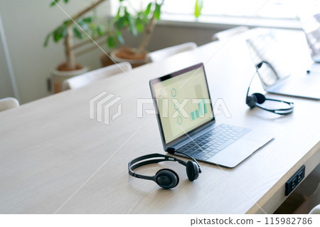 Computer and headphones in the office 115982786