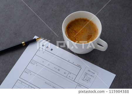 Drinking coffee and writing a resume Drinking coffee and writing a resume 115984388