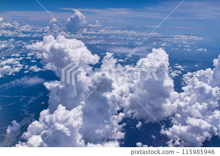 A boiling cumulonimbus cloud seen from an airplane A boiling cumulonimbus cloud seen from an airplane 115985946