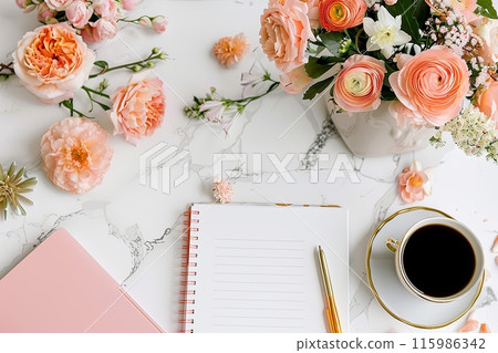 Flat lay white empty notebook with a pen and a cup of coffee on a table with a vase of flowers 115986342