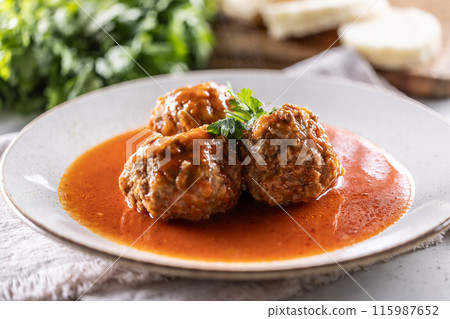 Traditional Italian meatballs with tomato sauce and parsley Traditional Italian meatballs with tomato sauce and parsley 115987652
