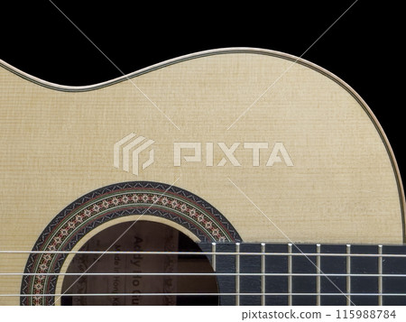 Close up of a Classical Guitar in Black Background 115988784