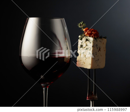 Glass of red wine and blue cheese. Glass of red wine and blue cheese. 115988997