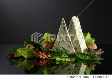 Blue cheese with walnuts and fresh greens. Blue cheese with walnuts and fresh greens. 115989016