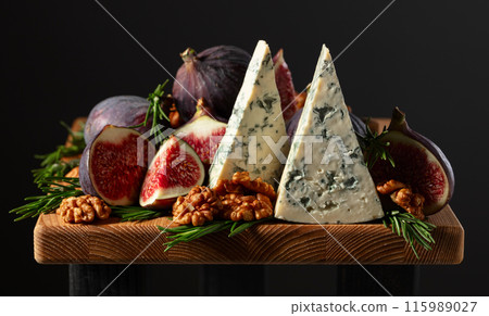 Blue cheese with figs, walnuts, and rosemary. Blue cheese with figs, walnuts, and rosemary. 115989027