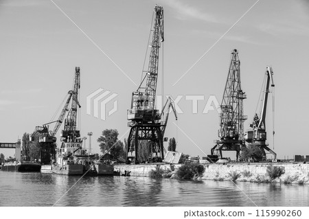 Portal cranes of Ruse port, Bulgaria. Black and white 115990260