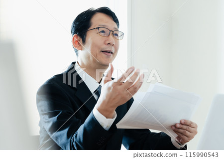 A professional man explaining A professional man explaining 115990543