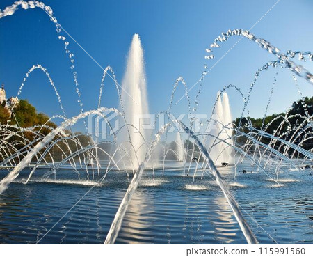 Fountain in the blue sky Fountain in the blue sky 115991560