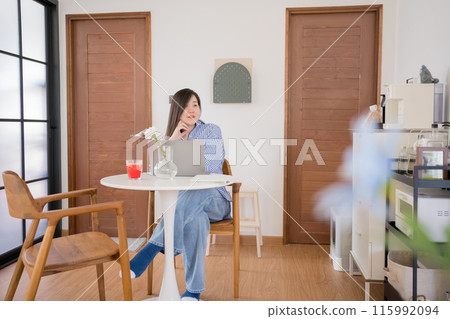 asian woman freelancer relax and happy during working from home asian woman freelancer relax and happy during working from home 115992094