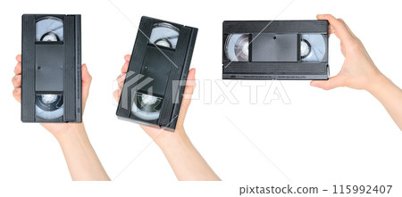 Set of Woman Hands which holding a Retro Old Analog Video Cassette, isolated on white background Set of Woman Hands which holding a Retro Old Analog Video Cassette, isolated on white background 115992407