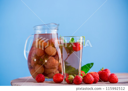 Sweet refreshing berry compote of ripe strawberries in a decanter Sweet refreshing berry compote of ripe strawberries in a decanter 115992512