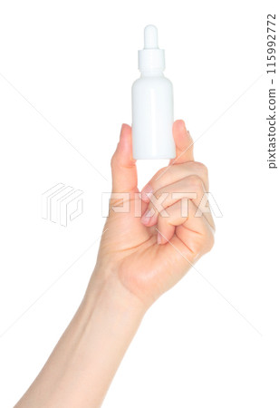 Woman hand holding a white cosmetic bottle, isolated on white background close-up, template Woman hand holding a white cosmetic bottle, isolated on white background close-up, template 115992772