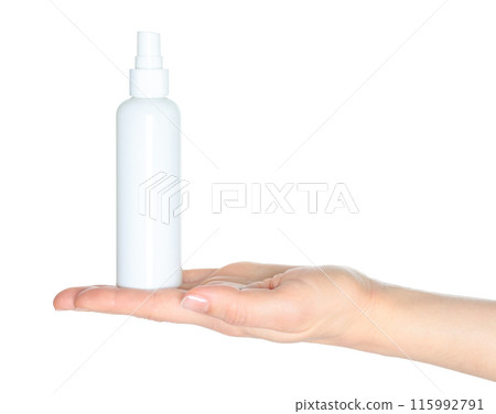 Woman hands holding a white spray bottle, isolated on white background close-up, template 115992791