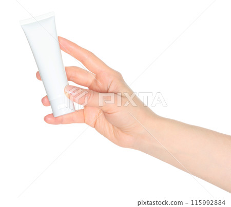 Woman hand holds a white cosmetic cream tube, on white background close-up, template for cosmetics 115992884