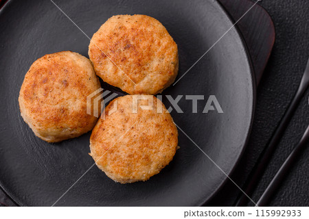 Delicious fresh fried minced fish cutlets with spices and herbs 115992933