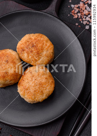 Delicious fresh fried minced fish cutlets with spices and herbs 115992934