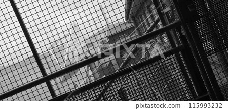 Satellite dish in Ludwigsburg photographed trough a wire net. 115993232