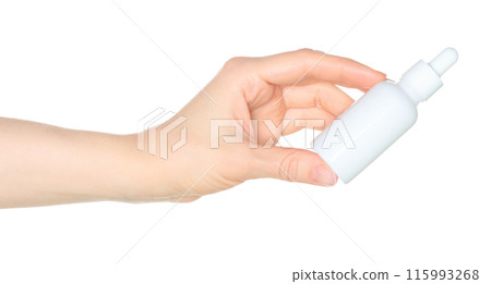 Woman hand holds a white cosmetic bottle, isolated on white background close-up, template 115993268