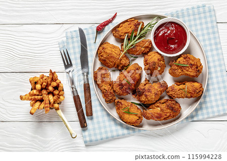 american style fried chicken wings on a plate 115994228
