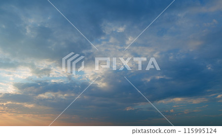Sunset or dawn backlit by warm sun. Panorama style background. Sunset or dawn sky. Timelapse. Sunset or dawn backlit by warm sun. Panorama style background. Sunset or dawn sky. Timelapse. 115995124