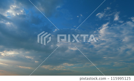 Lots of small clouds at sunset. Puffy fluffy cirrocumulus cloudscape slowly passed bright sun light rays. Timelapse. Lots of small clouds at sunset. Puffy fluffy cirrocumulus cloudscape slowly passed bright sun light rays. Timelapse. 115995125