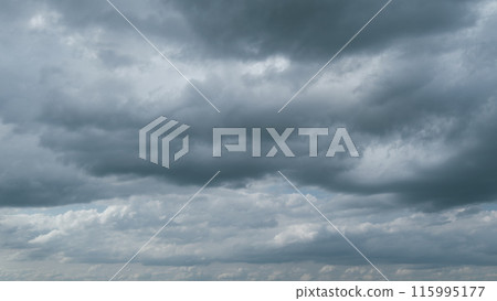 Rain clouds moving. Movement of air masses. White soft clouds quickly turning into dark grey. Timelapse. Rain clouds moving. Movement of air masses. White soft clouds quickly turning into dark grey. Timelapse. 115995177