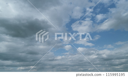 Forming cloud moving with blue sunny, summer skies. Clouds nature environment. Timelapse. 115995195