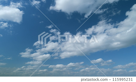 Clouds stratocumulus in tropical summer sunshine day. White cumulus cloudscape. Timelapse. Clouds stratocumulus in tropical summer sunshine day. White cumulus cloudscape. Timelapse. 115995231