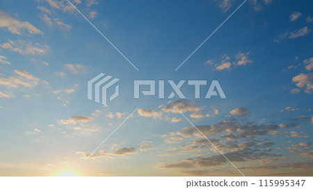 Orange and peach fluffy clouds and blue sky. Weather forecast. Time lapse. Orange and peach fluffy clouds and blue sky. Weather forecast. Time lapse. 115995347