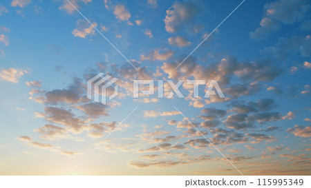 Fiery sunset clouds sky. Clear very nice soft deep blue sky with orange and peach rolling clouds. Time lapse. 115995349