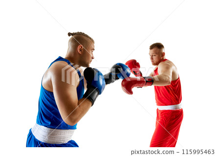 Training match, showcasing two fighters, boxer in blue attire striking at boxer dressed in red against white studio background. 115995463