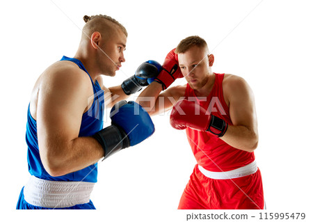 Two fighters in midst of sparring session, red competitor against blue competitor isolated white studio background. Close up photo. 115995479