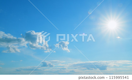 Beautiful scenic blue sky with rays of sun shining through clouds. Sun rays. Time lapse. Beautiful scenic blue sky with rays of sun shining through clouds. Sun rays. Time lapse. 115995541